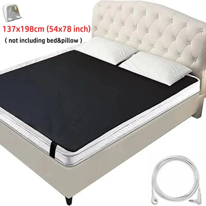 Black grounding mat on a bed with dimensions displayed